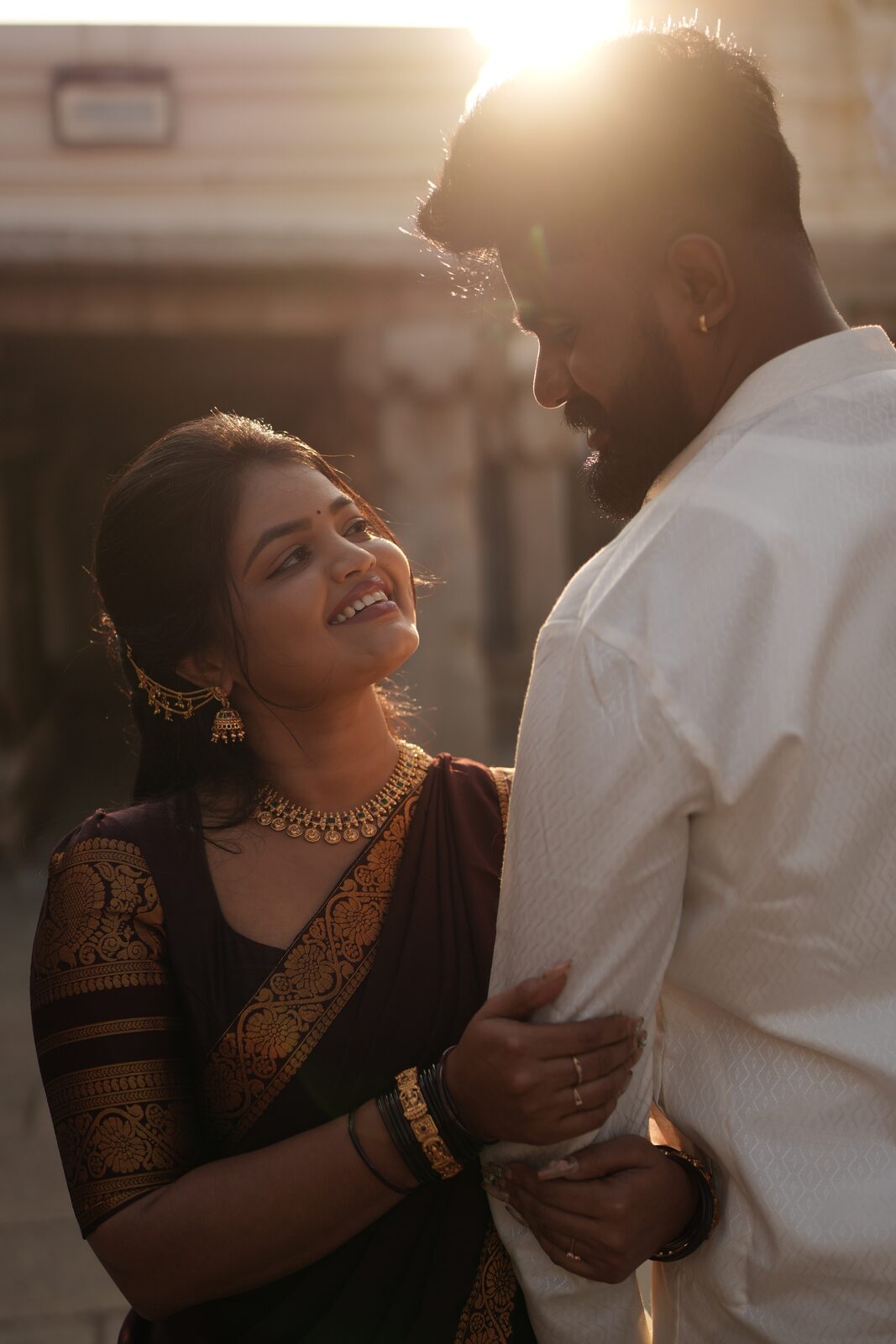 Deeksha and Karthik in warm golden light