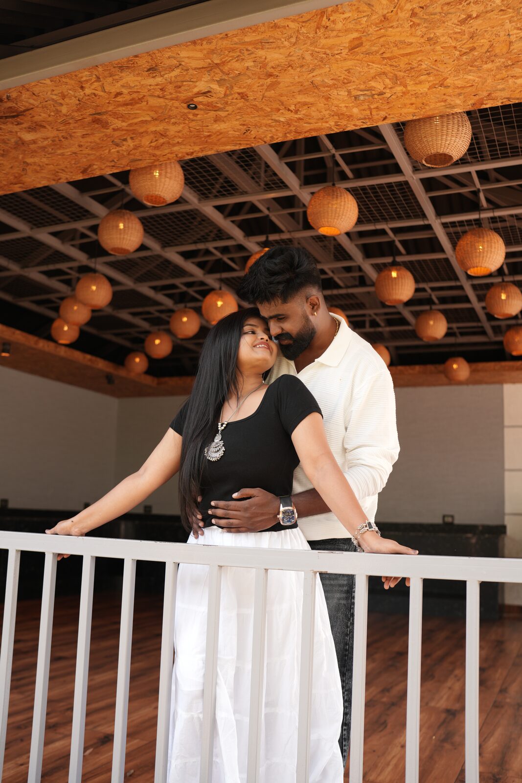 Karthik and Deeksha on a balcony